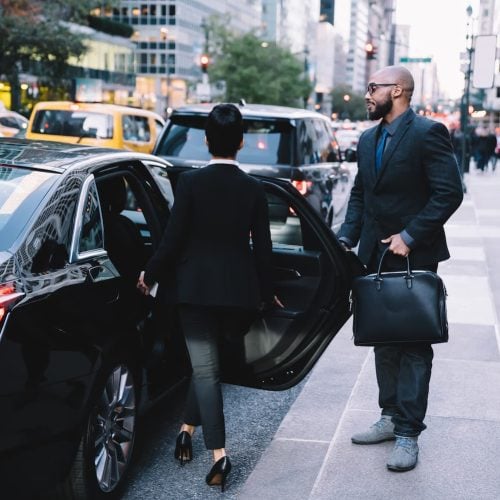 successful-business-partners-getting-in-car-at-cit-2024-05-28-17-44-19-utc-1.jpg